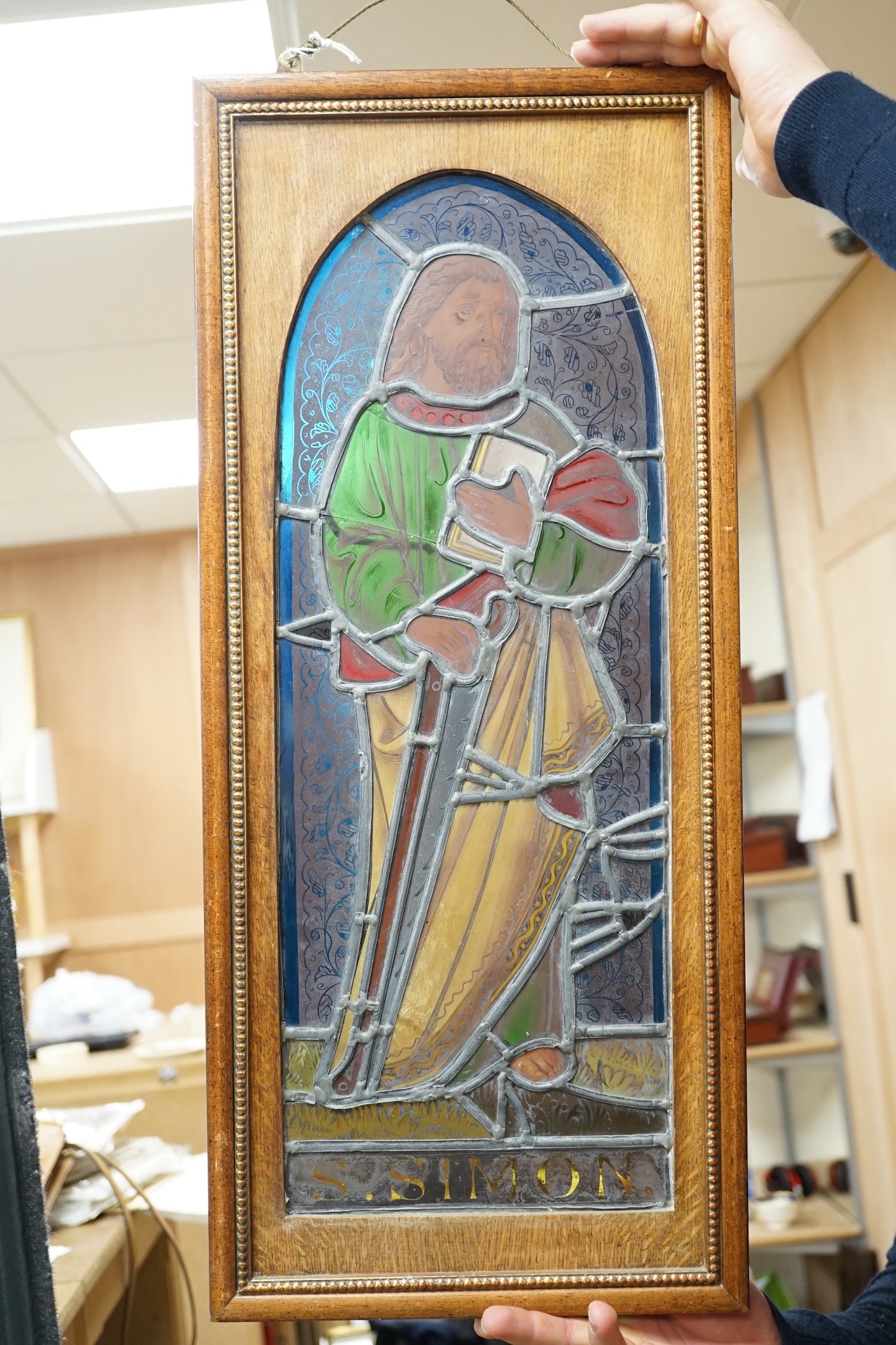 A pair of Victorian framed stained glass panels of St. Martin and St. Simon. 68.5cm tall